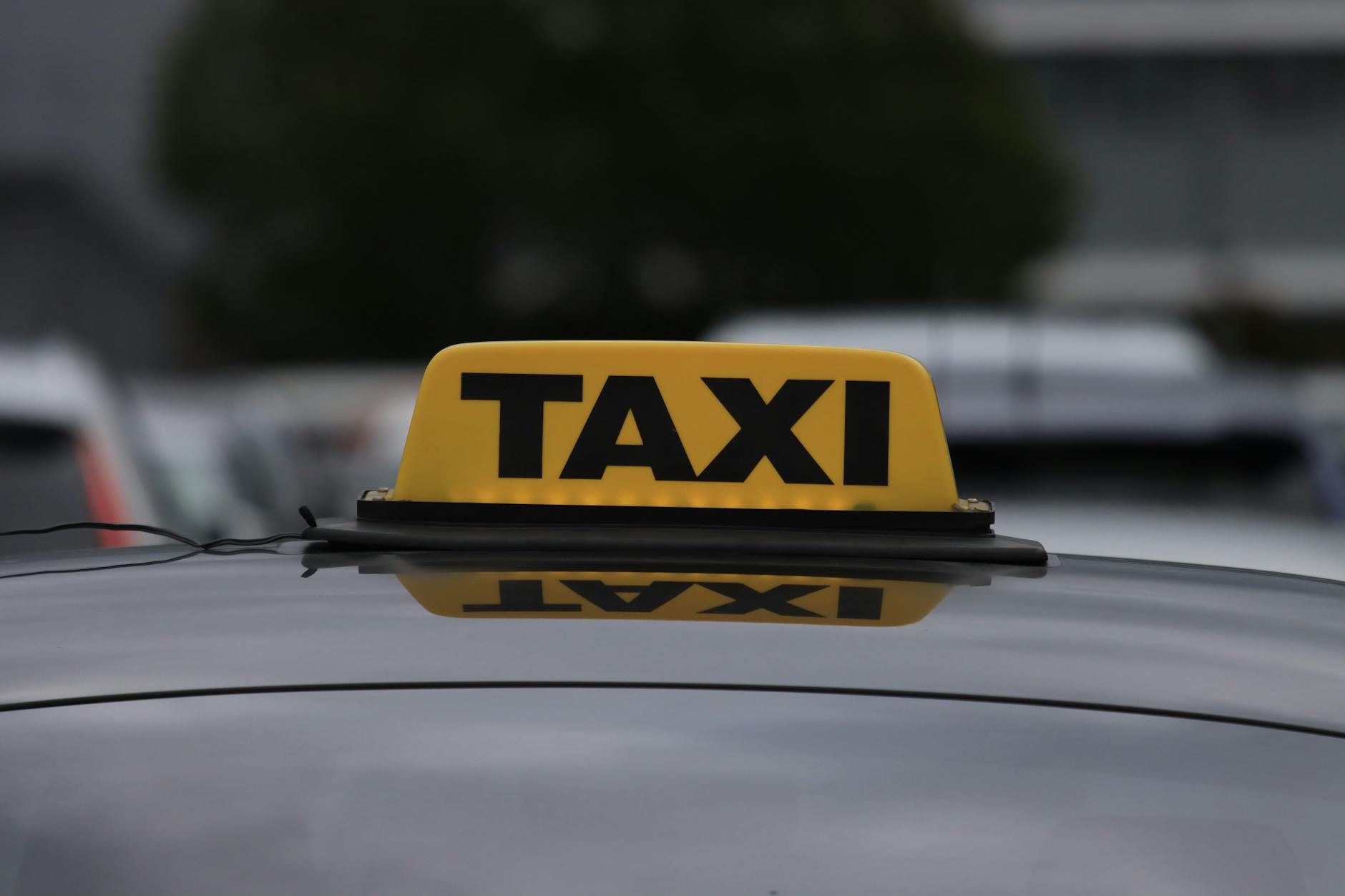 yellow taxi cab on road